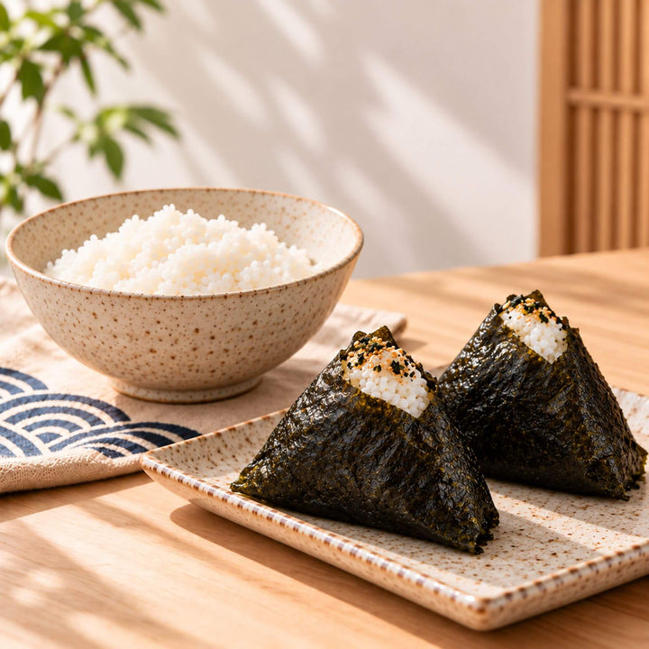 Two ready-to-eat onigiris and a bowl of rice